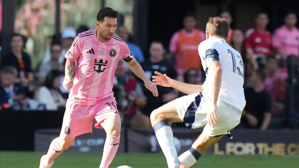 Inter-Miami-forward-Lionel-Messi-10-runs-with-the-ball-as-Vancouver-Whitecaps-forward-Thomas-Mueller-13-defends-during-the-first-half-of-the-MLS-Cup-final-soccer-match-Saturday-Dec-6-2025-in-Fort-Lauderdale-Fla