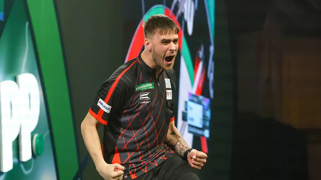 14-12-2025-2025-26-World-Darts-Championship-Dom-Taylor-hits-a-double-and-celebrates-during-the-2025-26-Paddy-Power-World-Darts-Championships-at-Alexandra-Palace-London-United-Kingdom-on-14-December-2025