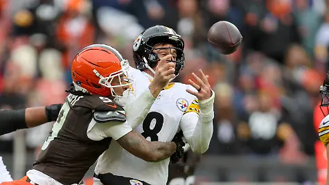 CLEVELAND-OH-DECEMBER-28-Pittsburgh-Steelers-quarterback-Aaron-Rodgers-8-fumbles-as-he-is-sacked-by-Cleveland-Browns-safety-Grant-Delpit-9-during-the-third-quarter-of-the-National-Football-League-game-between-the-Pittsburgh-Steelers-and-Cleveland-Browns-on-December-28-2025-at-Huntington-Bank-Field-in-Cleveland-OH