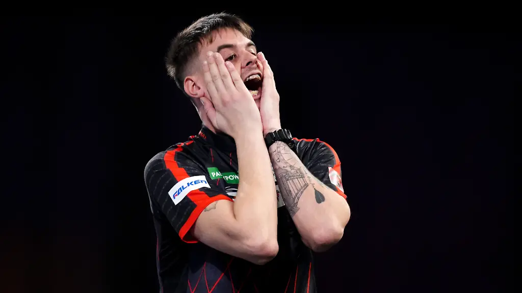 Paddy-Power-World-Darts-Championship-Day-Four-Alexandra-Palace-Dom-Taylor-reacts-during-his-match-against-Oskar-Lukasiak-on-day-four-of-the-Paddy-Power-World-Darts-Championship-at-the-Alexandra-Palace-London-Picture-date-Sunday-December-14-2025-See-PA-story-DARTS-World-Photo-credit-should-read-John-Walton-PA-Wire-RESTRICTIONS-Use-subject-to-restrictions-Editorial-use-only-no-commercial-use-without-prior-consent-from-rights-holder