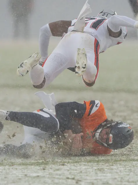 January-25-2026-Denver-Colorado-USA-New-England-Patriots-safety-JAYLINN-HAWKINS-21-sails-over-Denver-Broncos-quarterback-JARRETT-STIDHAM-8-in-the-AFC-Championship-football-game-between-the-Denver-Broncos-and-New-England-Patriots-Derek-Regensburger-CSM