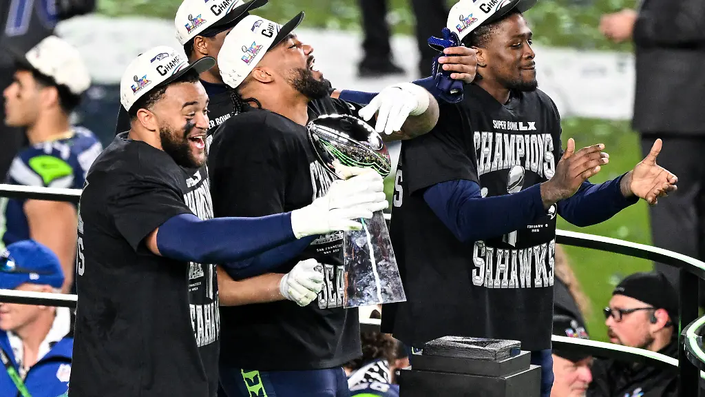 Seattle-Seahawks-teammates-hold-the-Vince-Lombardi-Trophy-after-winning-Super-Bowl-LX-against-the-New-England-Patriots-29-13-at-Levi-s-Stadium-in-Santa-Clara-California-on-Sunday-February-8-2026