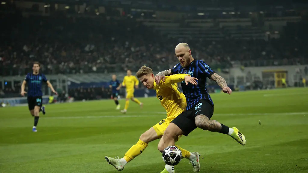 Federico-Di-Marco-of-FC-Inter-and-Jens-Petter-Hauge-of-FK-Bodo-Glimt-during-the-Uefa-Champions-League-second-leg-play-off-season-2025-2026-football-match-between-FC-Internazionale-Milano-v-Fotballklubben-Bodo-Glimt-on-24-February-2026-at-a-Giuseppe-Meazza-Stadium-San-Siro-Milan-Italy-Photo-Nderim-Kaceli