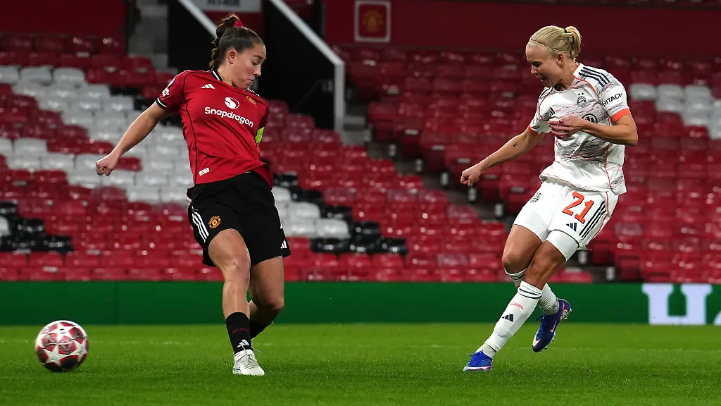 Bayern-Munich-s-Pernille-Harder-right-scores-their-side-s-first-goal-of-the-game-during-the-Women-s-Champions-League-match-between-Manchester-United-and-Bayern-Munich-in-Manchester-England-Wednesday-March-25-2026
