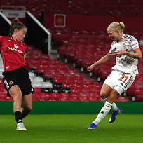 Bayern-Munich-s-Pernille-Harder-right-scores-their-side-s-first-goal-of-the-game-during-the-Women-s-Champions-League-match-between-Manchester-United-and-Bayern-Munich-in-Manchester-England-Wednesday-March-25-2026