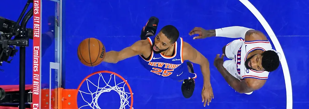 New-York-Knicks-Mikal-Bridges-left-goes-up-for-a-shot-against-Philadelphia-76ers-Paul-George-during-the-second-half-of-Game-3-in-a-second-round-NBA-basketball-playoff-series-Friday-May-8-2026-in-Philadelphia