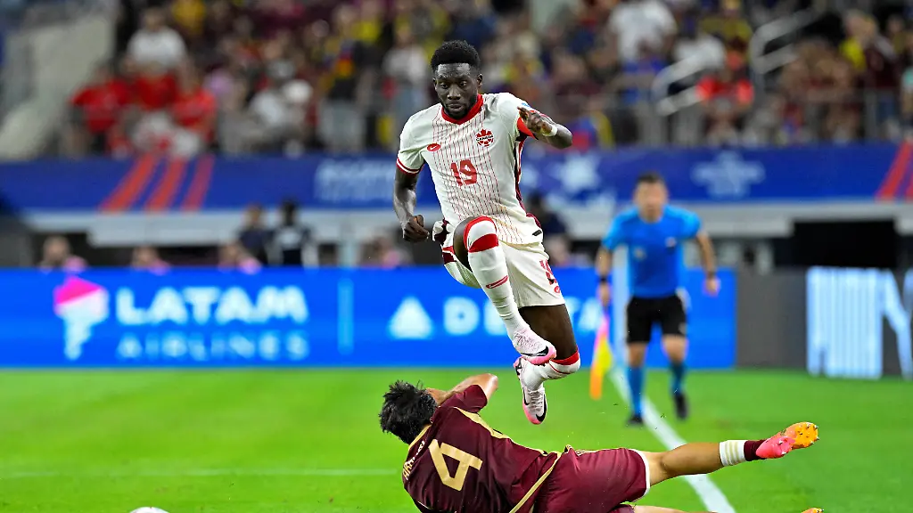 FILE-PHOTO-Jul-5-2024-Arlington-TX-USA-Venezuela-defender-Jon-Mikel-Aramburu-4-knocks-the-ball-away-from-Canada-defender-Alphonso-Davies-19-during-the-first-half-in-the-2024-Copa-America-quarterfinal-at-AT-T-Stadium