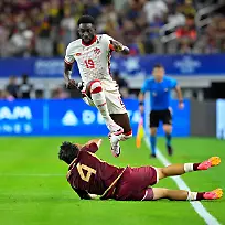 FILE-PHOTO-Jul-5-2024-Arlington-TX-USA-Venezuela-defender-Jon-Mikel-Aramburu-4-knocks-the-ball-away-from-Canada-defender-Alphonso-Davies-19-during-the-first-half-in-the-2024-Copa-America-quarterfinal-at-AT-T-Stadium