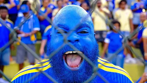 WILLEMSTAD-An-ecstatic-football-fan-during-the-friendly-international-match-Laenderspiel-Nationalmannschaft-between-Curacao-and-Aruba-at-the-Ergilio-Hato-Stadium-In-the-run-up-to-the-World-Cup-in-the-United-States-Canada-and-Mexico-Curacao-won-its-farewell-match-in-Willemstad-4-0-against-Aruba-RAMSAY-SOEMANTA-ANP-xVIxANPxSportx-xxANPxIVx-560351543-originalFilename-560351543
