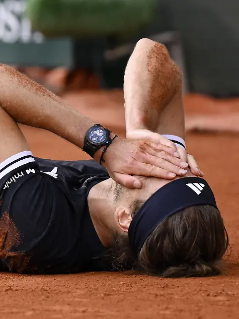 Alexander-Zverev-of-Germany-lies-on-his-back-after-beating-Flavio-Cobolli-of-Italy-in-the-men-s-singles-final-of-the-French-Open-tennis-tournament-in-Paris-on-June-7-2026