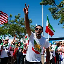 June-7-2026-Inglewood-California-USA-HAMED-RAZIPOUR-one-of-the-protest-organizers-leads-the-crowd-in-a-chant-in-front-of-SoFi-Stadium-in-Inglewood-California-during-a-demonstration-urging-FIFA-to-replace-the-Islamic-Republic-flag-with-the-Lion-and-Sun-flag