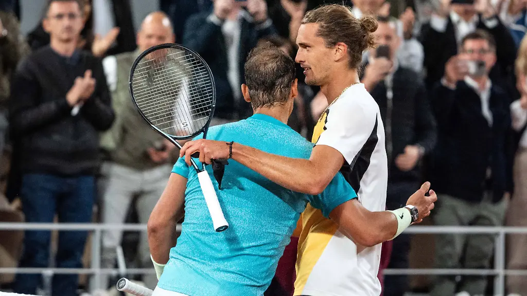 French-Open-Nadal-Loses-On-Possible-Farewell-Spain-s-Rafael-Nadal-R-checks-hands-with-the-winner-Germany-s-Alexander-Zverev-after-their-men-s-singles-match-on-Court-Philippe-Chatrier-on-day-two-of-the-French-Open-tennis-tournament-at-the-Roland-Garros-Complex-in-Paris-on-May-27-2024-Nadal-s-return-to-the-French-Open-and-possible-farewell-ended-at-the-first-hurdle-as-the-14-time-winner-lost-to-Alexander-Zverev-The-22-time-Grand-Slam-champion-was-beaten-6-3-7-6-7-5-6-3-by-the-in-form-German-fourth-seed-Nadal-has-become-synonymous-with-Roland-Garros-but-in-front-of-a-partisan-crowd-he-could-not-replicate-the-level-which-has-made-him-almost-unbeatable-on-the-Paris-clay-Photo-by-Alexis-Jumeau-ABACAPRESS