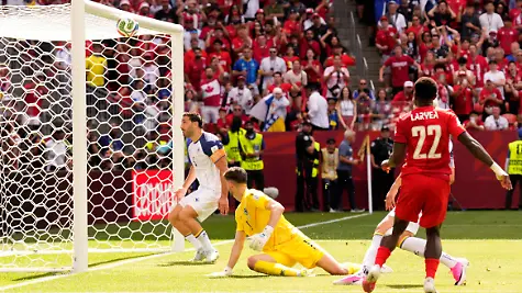Canada-s-Richie-Laryea-22-watches-as-his-shot-at-goal-is-cleared-away-off-the-crossbar-by-Bosnia-s-Sead-Kolasinac-rear-the-second-half-of-the-World-Cup-Group-B-soccer-match-between-Canada-and-Bosnia-Friday-June-12-2026-in-Toronto