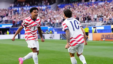 Weston-Mckennie-and-Christian-Pulisic-of-USA-celebrate-an-own-goal-scored-by-Damian-Bobadilla-of-Paraguay-during-the-FIFA-World-Cup-2026-Group-D-match-between-USA-and-Paraguay-at-Los-Angeles-Stadium-on-June-12-2026-in-Los-Angeles-California