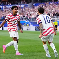 Weston-Mckennie-and-Christian-Pulisic-of-USA-celebrate-an-own-goal-scored-by-Damian-Bobadilla-of-Paraguay-during-the-FIFA-World-Cup-2026-Group-D-match-between-USA-and-Paraguay-at-Los-Angeles-Stadium-on-June-12-2026-in-Los-Angeles-California