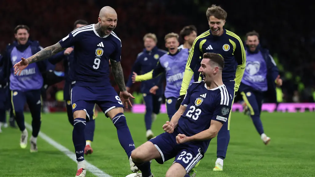 Soccer-Football-FIFA-World-Cup-UEFA-Qualifiers-Group-C-Scotland-v-Denmark-Hampden-Park-Glasgow-Scotland-Britain-November-18-2025-Scotland-s-Kenny-McLean-celebrates-scoring-their-fourth-goal-with-Lyndon-Dykes-REUTERS-Russell-Cheyne