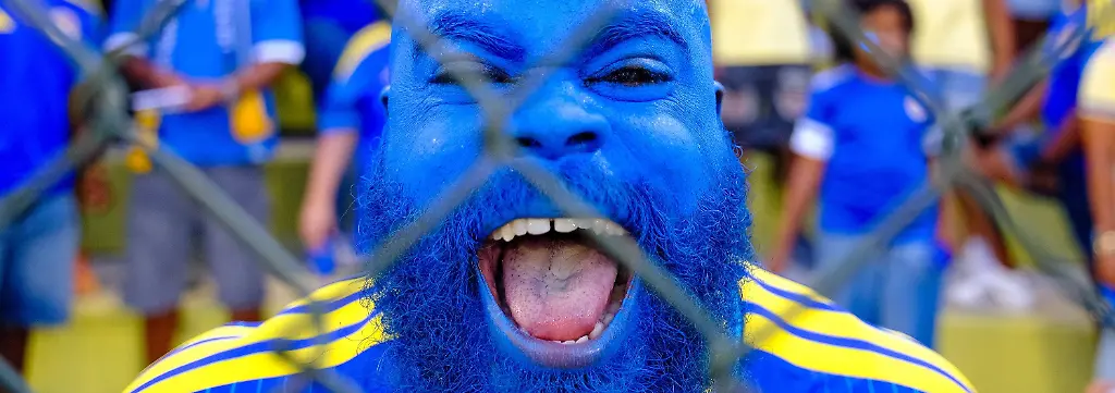 WILLEMSTAD-An-ecstatic-football-fan-during-the-friendly-international-match-Laenderspiel-Nationalmannschaft-between-Curacao-and-Aruba-at-the-Ergilio-Hato-Stadium-In-the-run-up-to-the-World-Cup-in-the-United-States-Canada-and-Mexico-Curacao-won-its-farewell-match-in-Willemstad-4-0-against-Aruba-RAMSAY-SOEMANTA-ANP-xVIxANPxSportx-xxANPxIVx-560351543-originalFilename-560351543